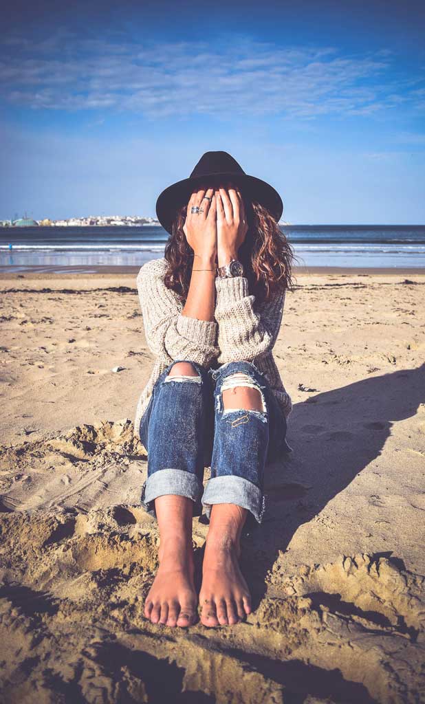 Girl with face in her hands